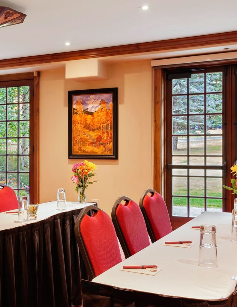 A room with a table and chairs.