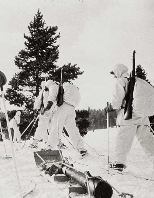 A group of skiers on a snowy slope.