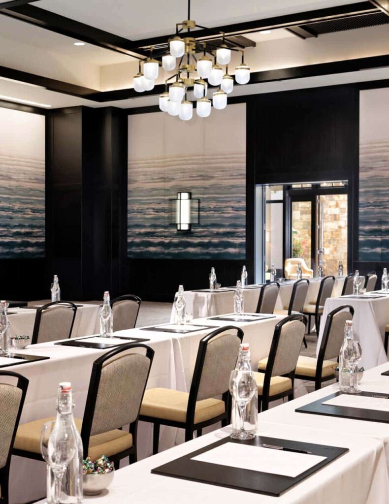A conference room set up with tables and chairs at Four Seasons Resort.