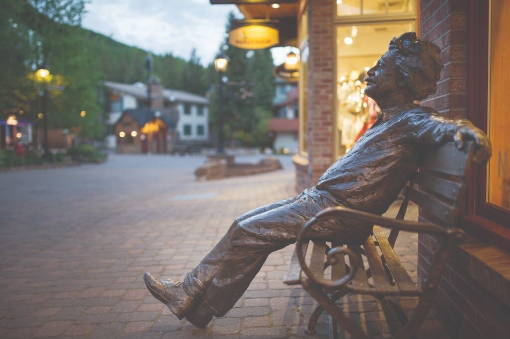 Side view of Albert Einsten bench next to Vail shop