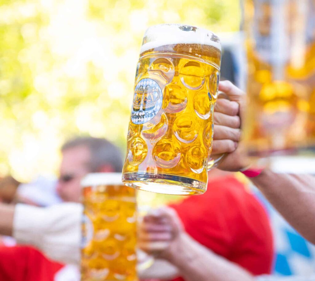 Oktoberfest in Vail- man holding 2 beers