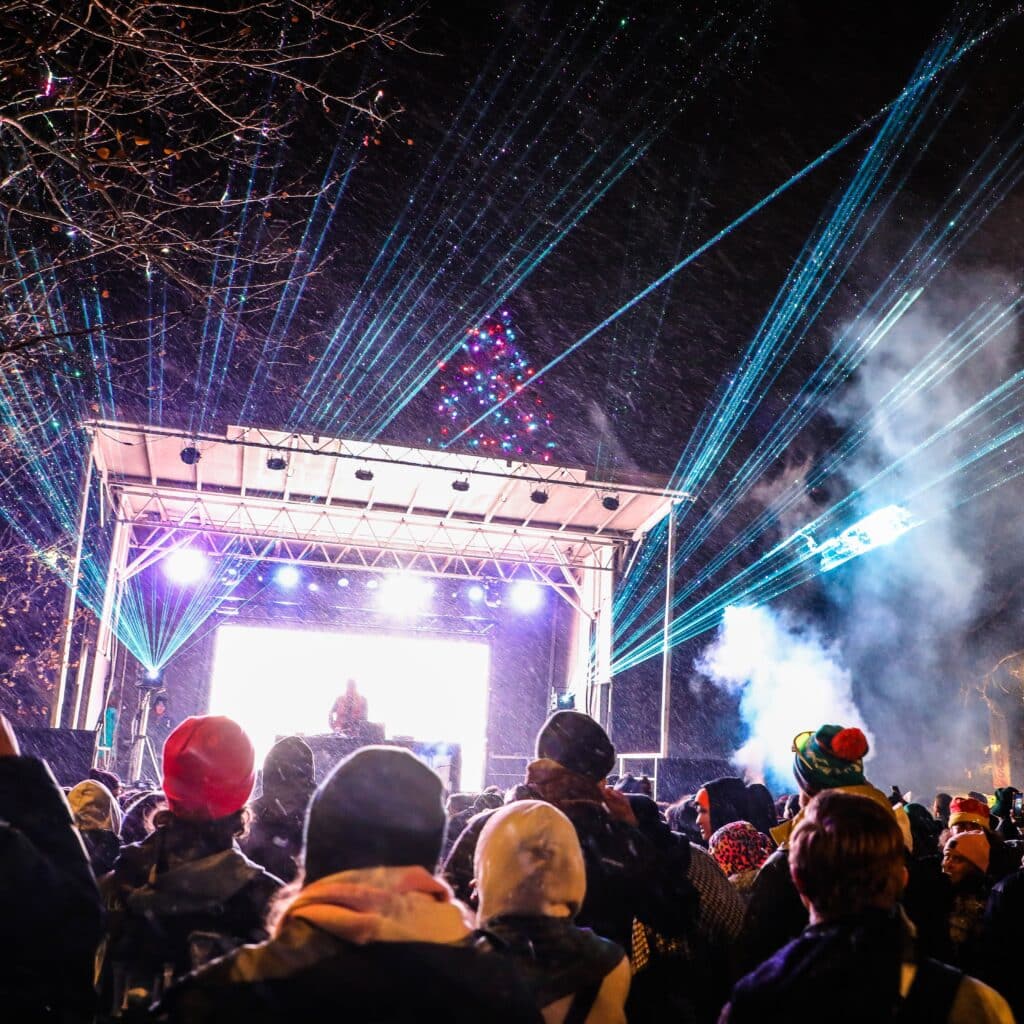 Bright lights and lively crowd at winter outdoor concert in Vail, Colorado