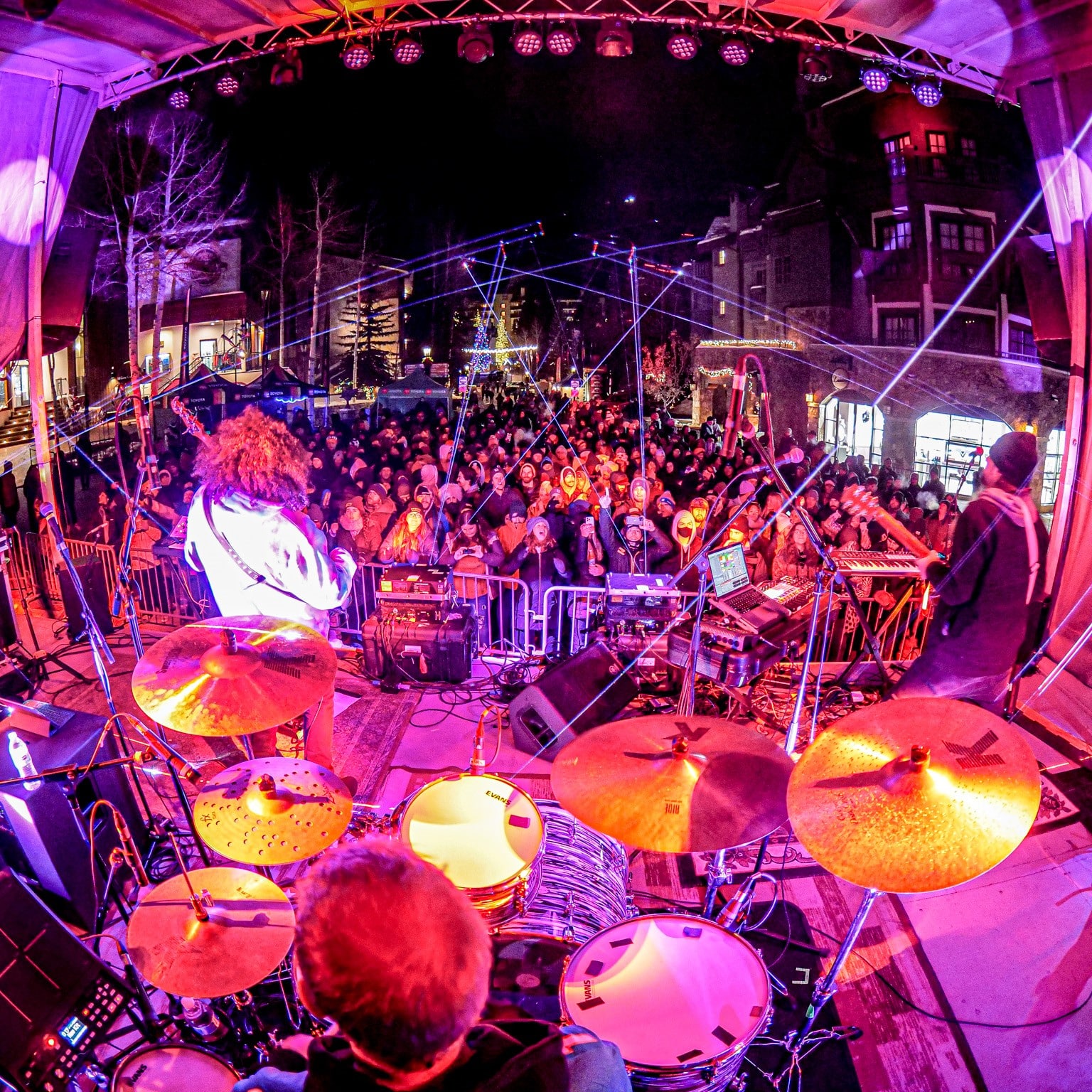 Bright lights and lively crowd at winter outdoor concert in Vail, Colorado