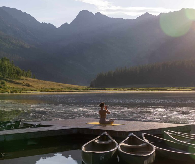 A woman doing yoga on Piney Lake