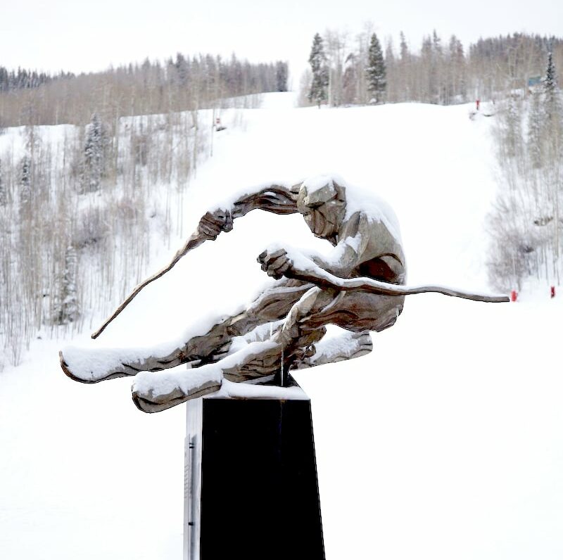 contemporary bronze sculpture of a ski racer