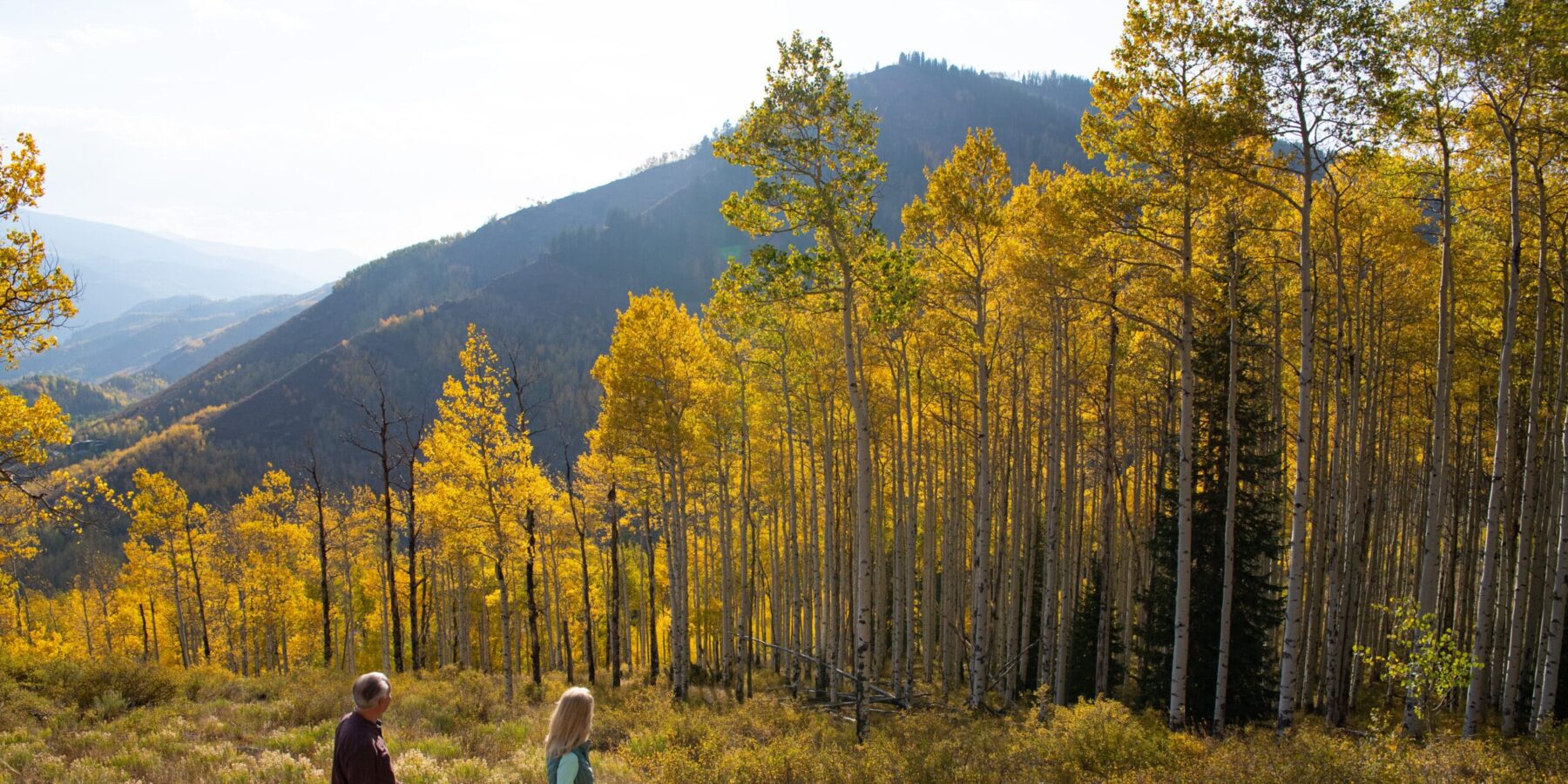 A couple doing a fall hike in Vail Mountain