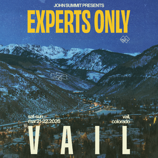Aerial view of Vail, Colorado at dusk with mountains in the background; text promotes an event called "Experts Only" on March 21-22, 2026, presented by John Summit.