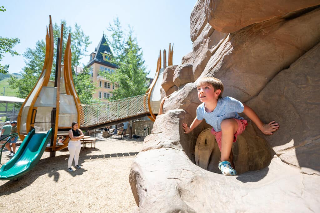A child romps and explores the hidden spots of Sunbird Park in Vail, Colorado.
